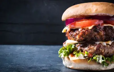 Juicy game meat burger with fresh tomato and lettuce