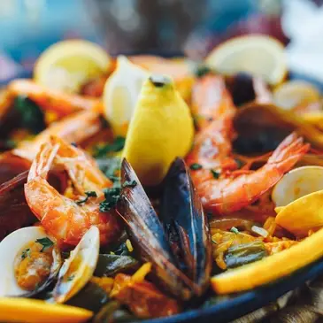 High protein seafood paella with shrimp, mussels and lemon