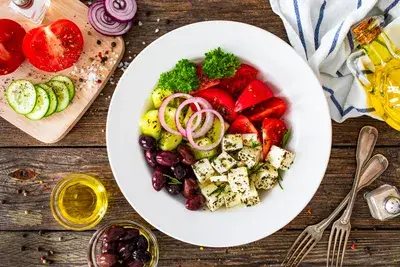 Classic Greek salad with feta cheese, olives, tomatoes and red onion