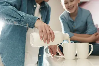 Man pouring milk as a high protein drink option